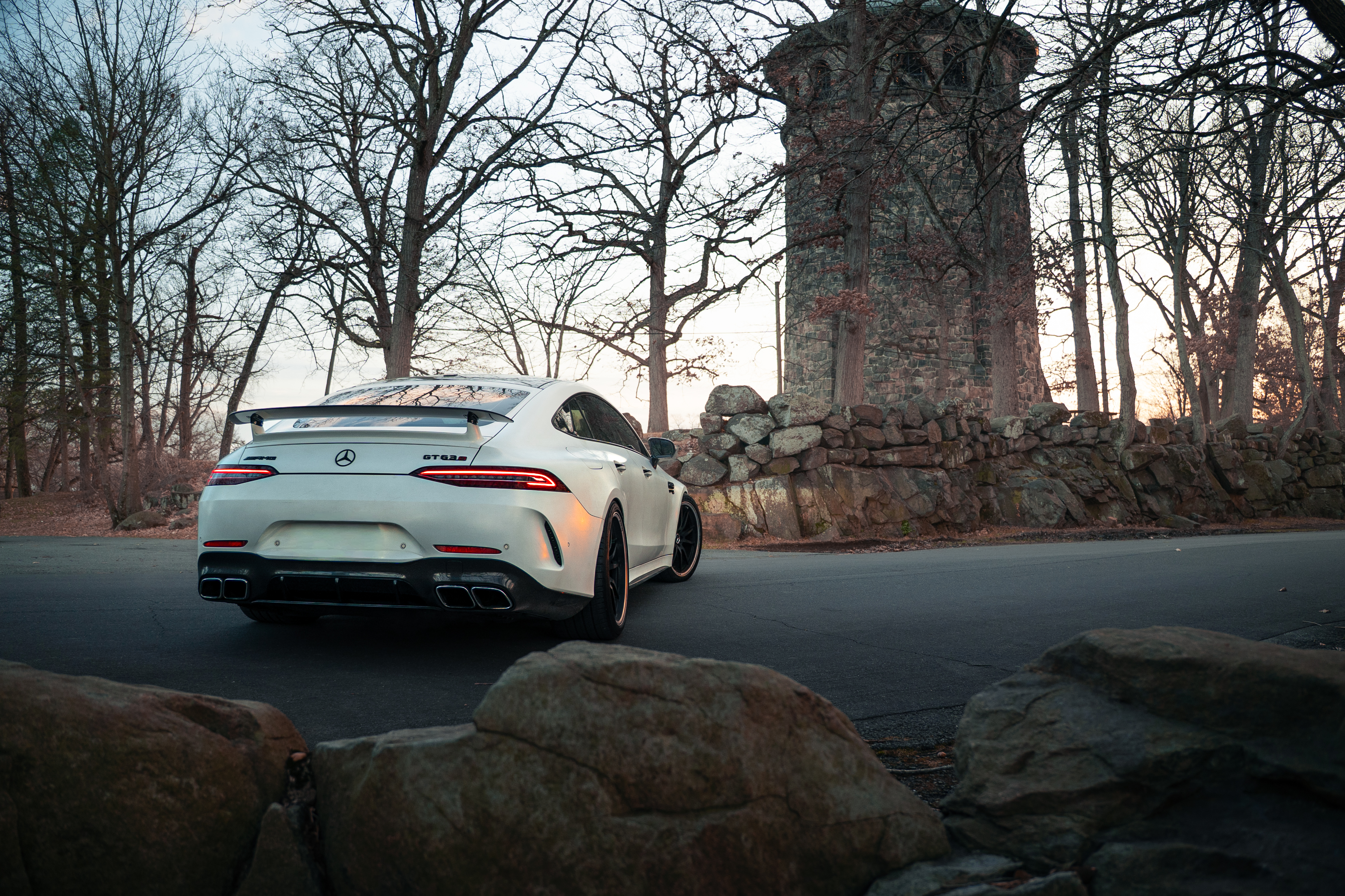 High-performance sports car with scenic background and dramatic lighting in automotive photography setting